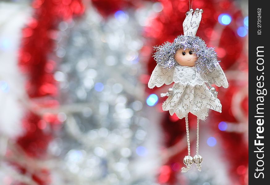 On the shiny, new year background toy handmade white angel