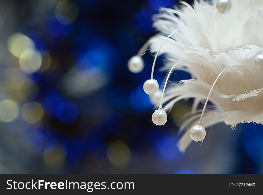 On a blue background with a large white lights Christmas Toy. On a blue background with a large white lights Christmas Toy