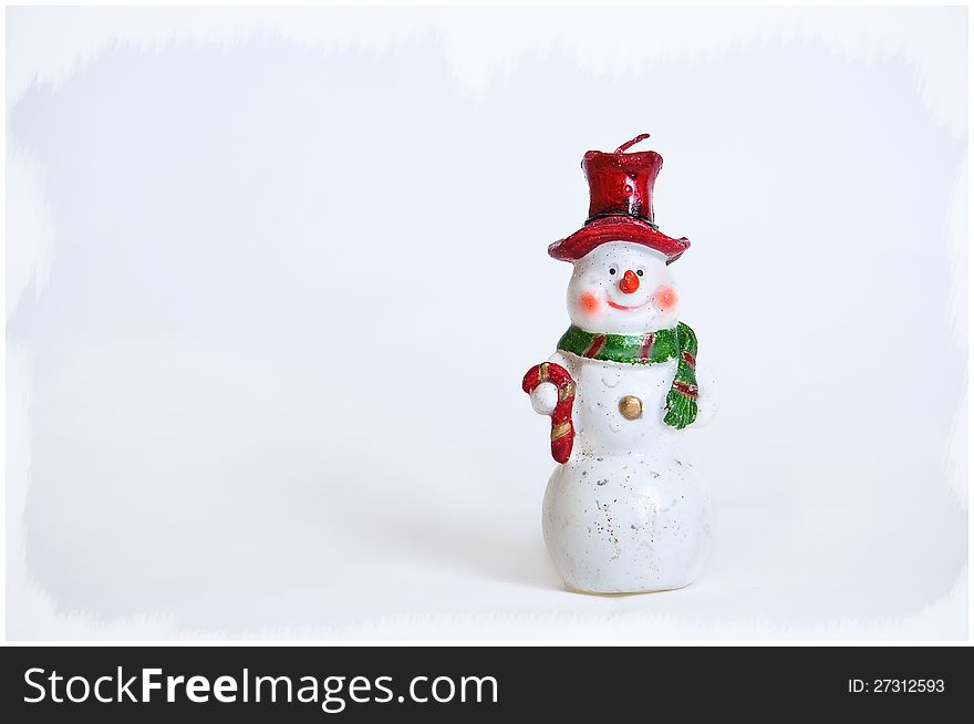 Snowman on a white background in a red cap with a green scarf. Snowman on a white background in a red cap with a green scarf