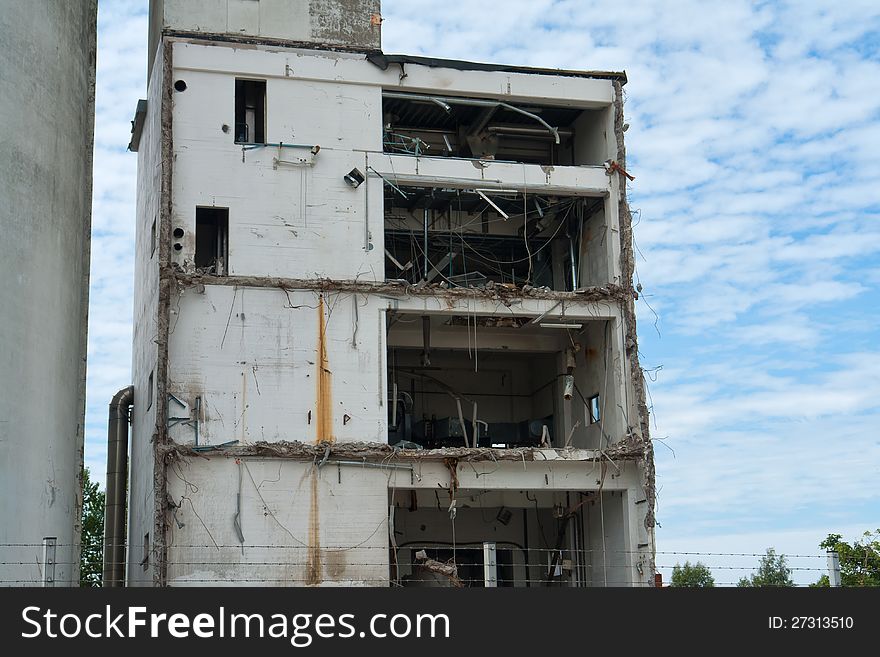 Demolition of a building house in a construction site