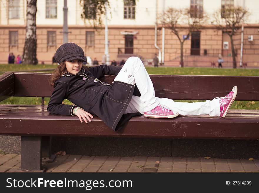 Little preteen girl standing outdoor near at autumn. Little preteen girl standing outdoor near at autumn