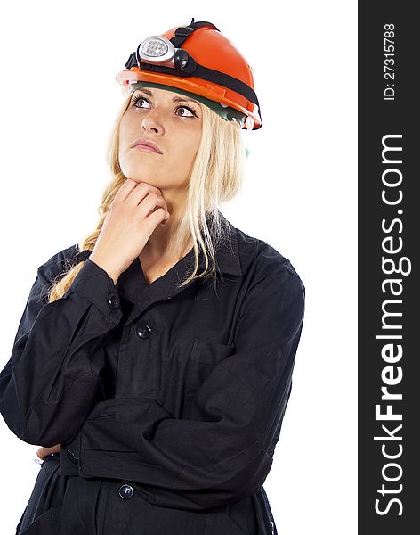 Girl in a helmet thinking the builder