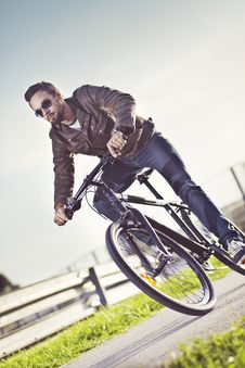 Young Man Riding A Bicycle Royalty Free Stock Photography