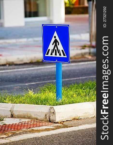 Traffic sign a pedestrian crossing.