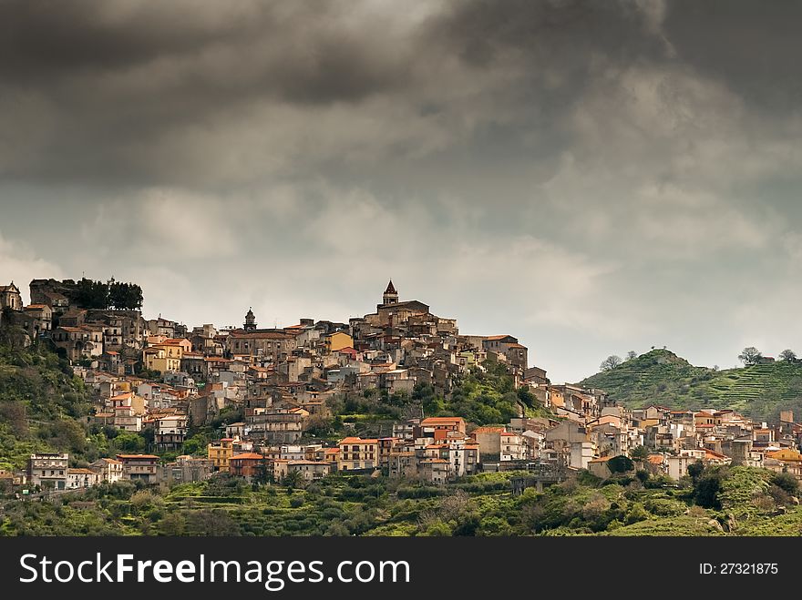 View of old village uphill in Sicily, Italy before the storm. View of old village uphill in Sicily, Italy before the storm.