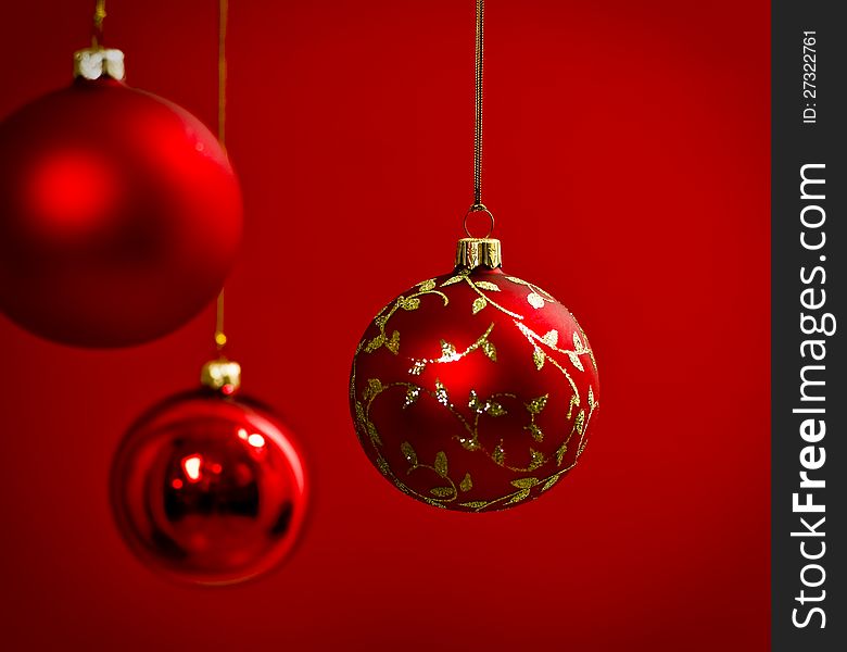Red christmas balls against red background. Red christmas balls against red background