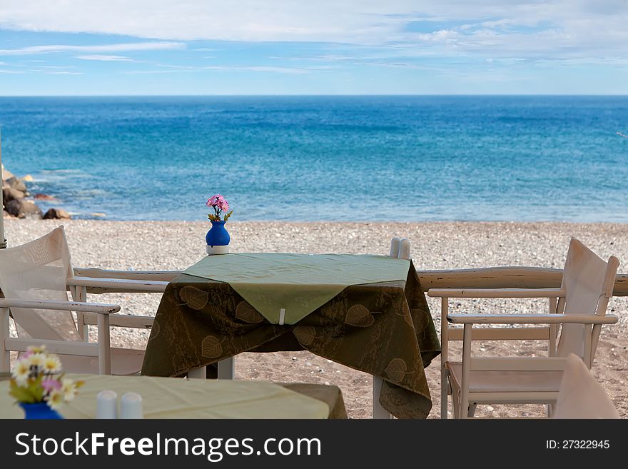 Table on the beach, Santorini island, Greece. Table on the beach, Santorini island, Greece