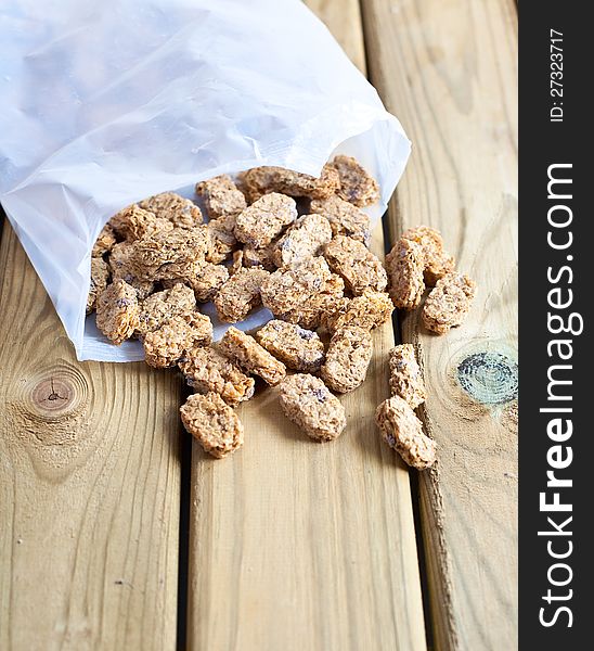 Wholegrain wheat snack on a wooden table