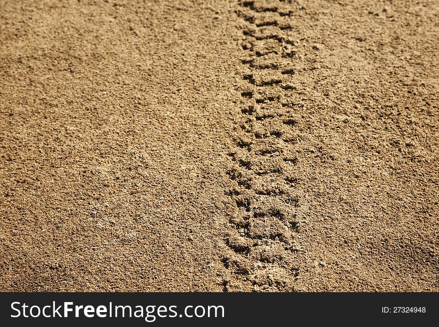 Tire tracks in sand