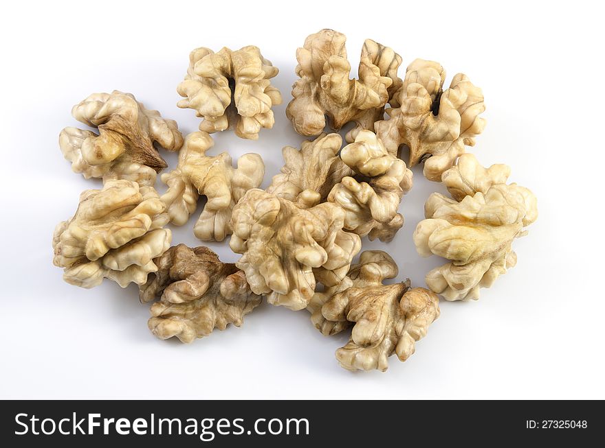 Some walnuts on white background.
