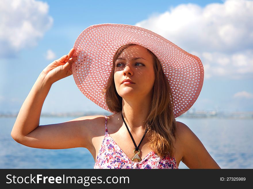 Portrait of the girl in beach hat. Portrait of the girl in beach hat
