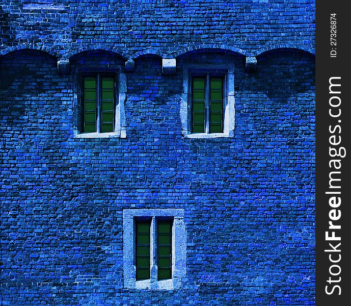 Blue brick wall with windows