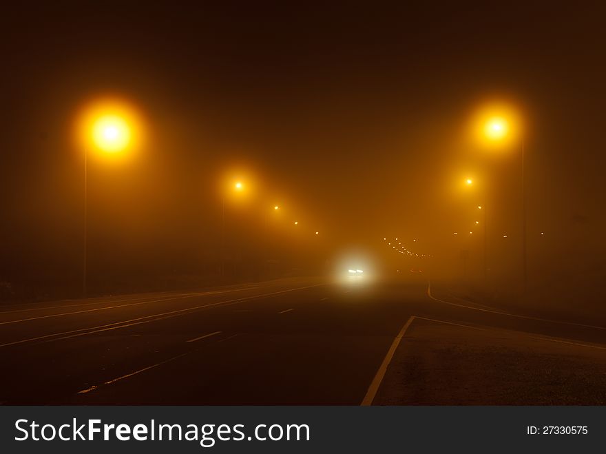 Fog in the light of lamps on an autobath at night. Fog in the light of lamps on an autobath at night