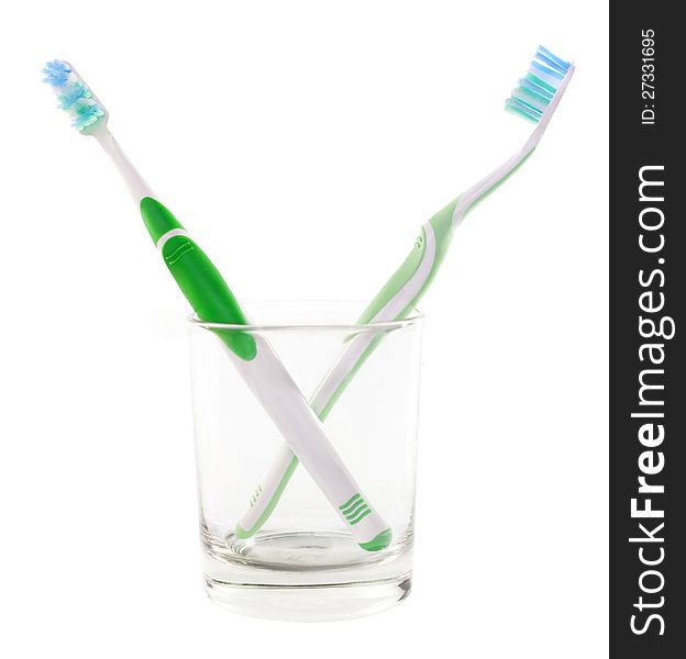 Two green toothbrushes