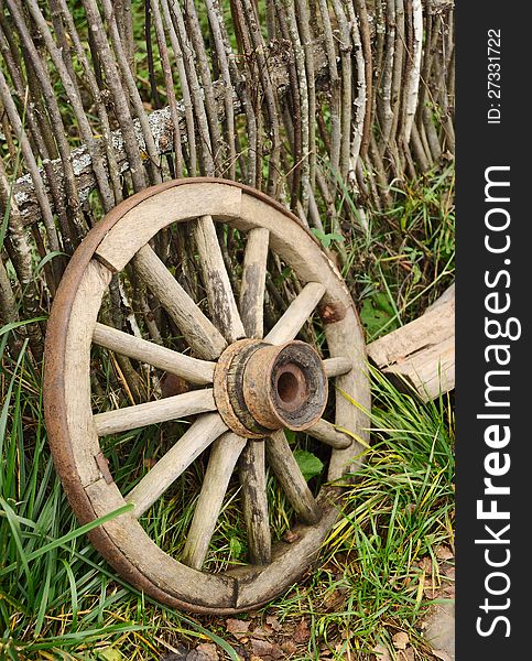 Old wooden wheel from a cart. Old wooden wheel from a cart