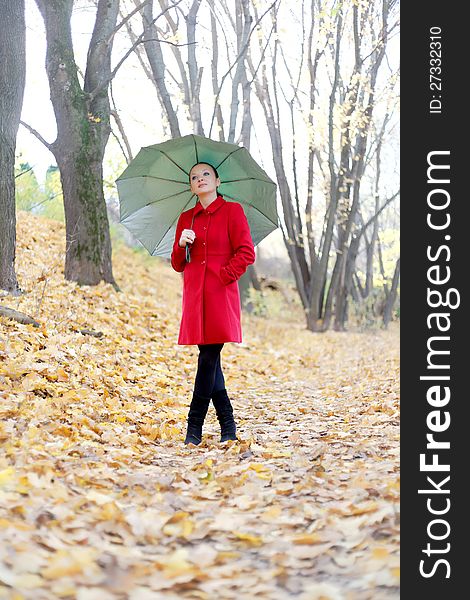 Pretty Girl In The Autumn Forest With Umbrella