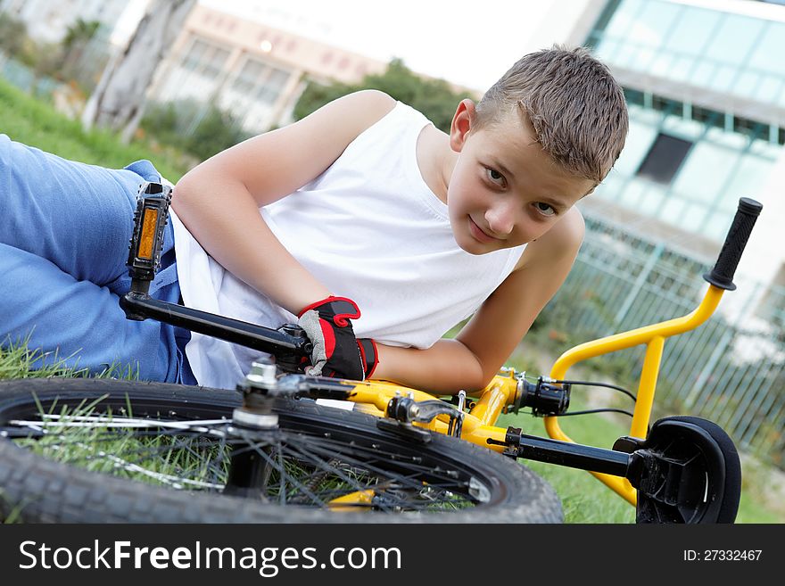 Cute Boy With His Bicycle Outside