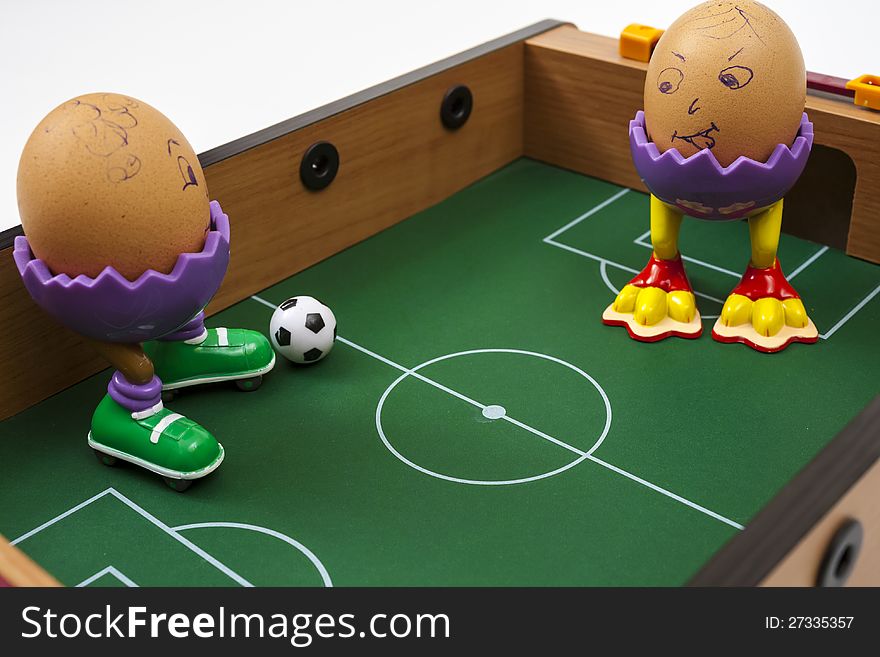 Two eggs playing soccer small soccer table