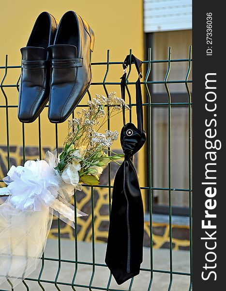 Shoes and tie of a groom wedding suit in outdoor . Shoes and tie of a groom wedding suit in outdoor .