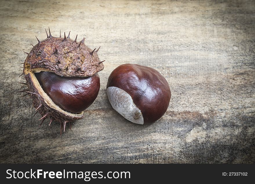 Nice shot of chestnuts on wood texture