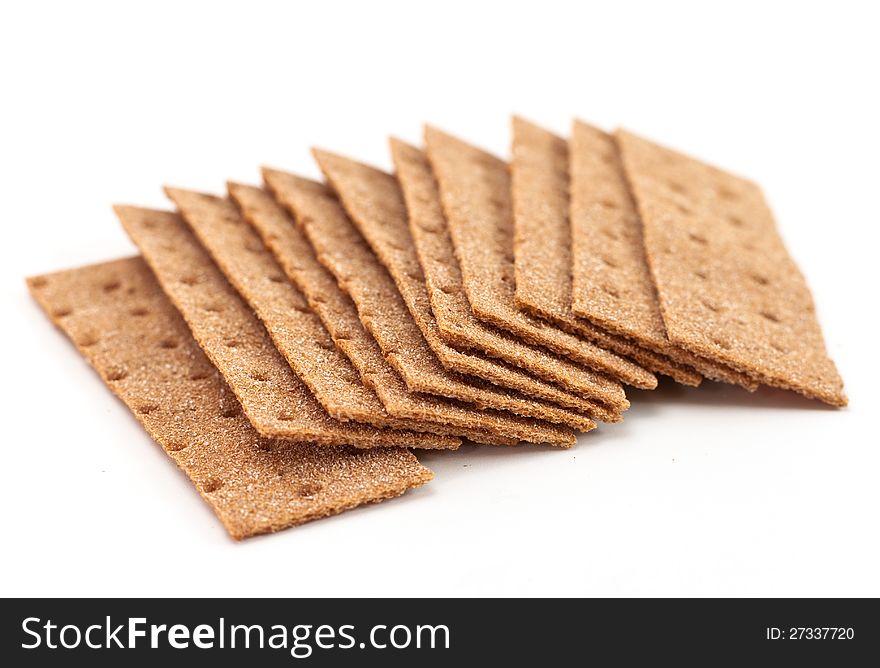 Handful of crispbread on white background