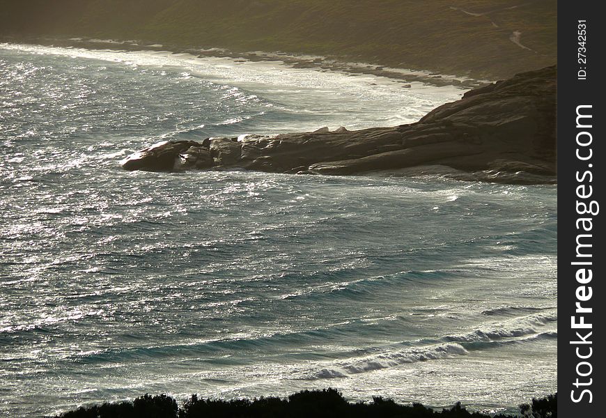 Icy Waves And Rocky Seaside.