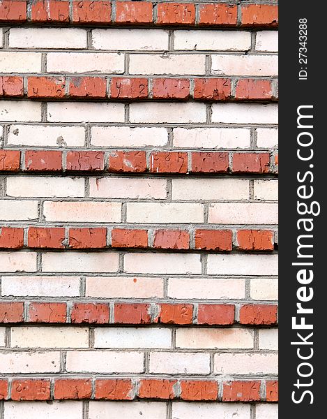 Background of the stripes of red and white brick