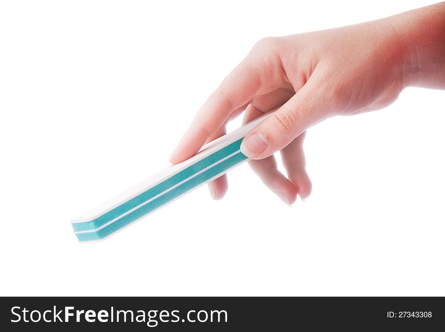 Woman's hand with the nail file isolated on white background. Woman's hand with the nail file isolated on white background