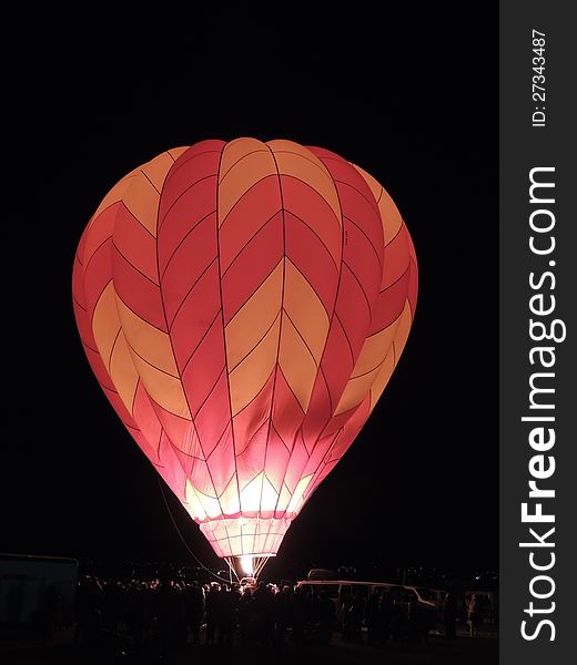 To give observers a thrill, balloonists make their balloons glow with blasts of burning propane. Not part of an organized event. To give observers a thrill, balloonists make their balloons glow with blasts of burning propane. Not part of an organized event.
