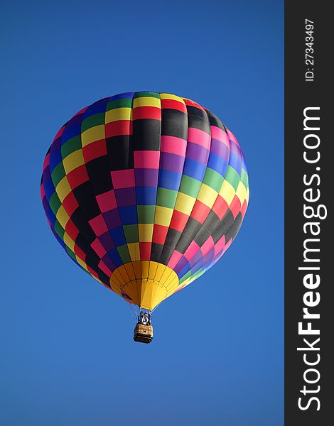 Notice the incredible artistry in the choice of colors and checkered patterns used in the fabric of this balloon. Not part of an organized event. Notice the incredible artistry in the choice of colors and checkered patterns used in the fabric of this balloon. Not part of an organized event.