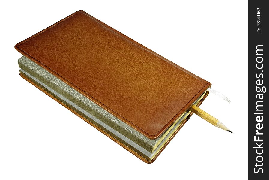 Closed notebook with a pencil on a white background