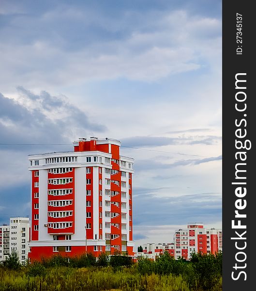 Buildings in a city in an environment of green trees. Buildings in a city in an environment of green trees