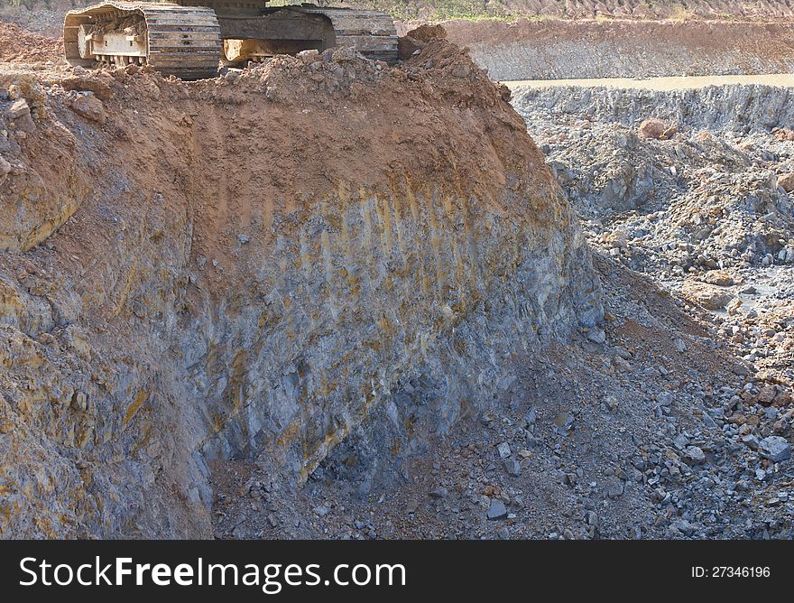 Caterpillar Backhoe On The Cliffs.