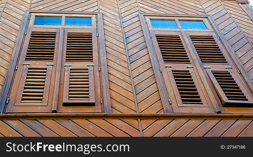 Old house made, wooden planks, its windows closed wooden shutters. Old house made, wooden planks, its windows closed wooden shutters.