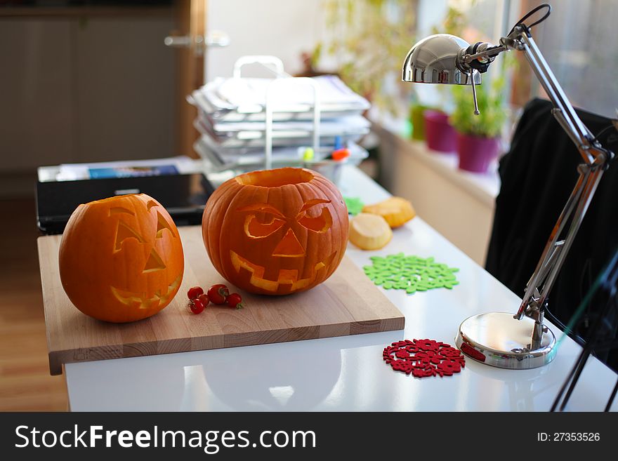 Image of two beautiful pumpkins on white table. Image of two beautiful pumpkins on white table