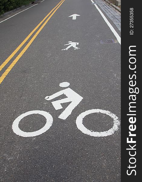 White painted signs for bike and rollerblades line