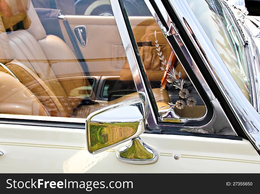 Rear view mirror of a classic car. Rear view mirror of a classic car