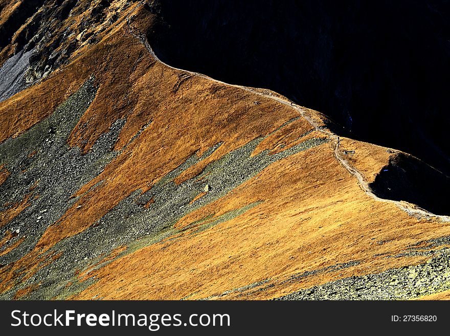 Background depicting a mountain ridge in the fall colors in the afternoon