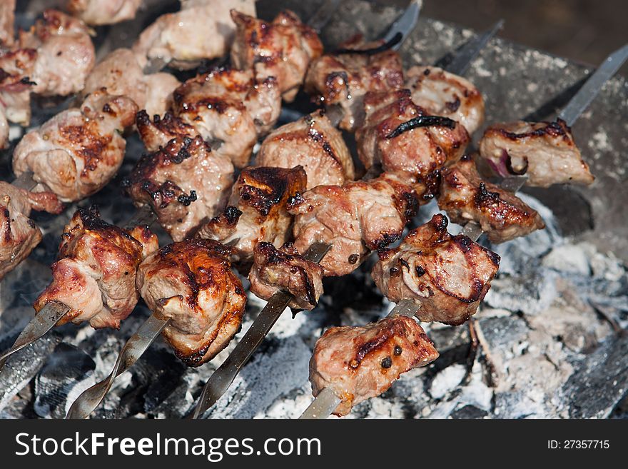 Barbecue meat slices prepared on fire. Barbecue meat slices prepared on fire