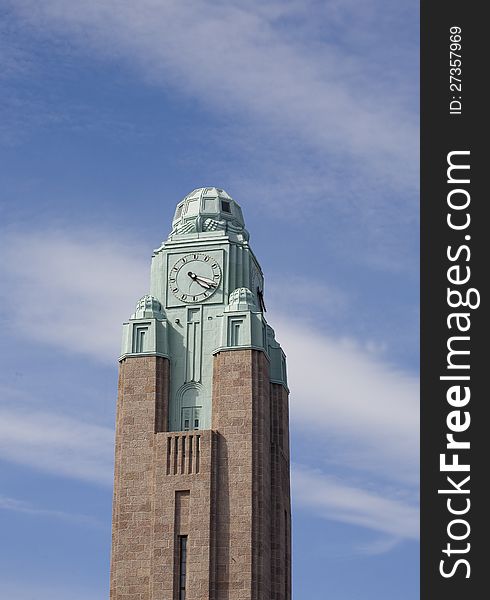 Clock tower Helsinki unde a blue sky with some clouds