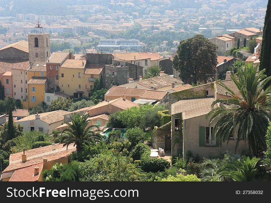 Hyeres, typical village on the hillside, with its typical bell tower, coloured houses, palm trees. Hyeres, typical village on the hillside, with its typical bell tower, coloured houses, palm trees