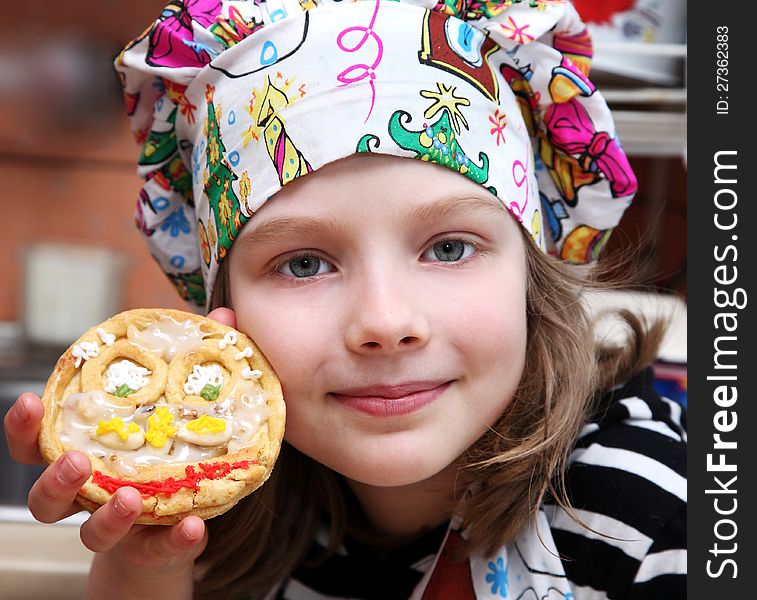 Cook girl holding a  ester cake. Cook girl holding a  ester cake