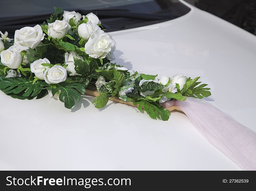 Artificial roses, wedding decoration of a car. Artificial roses, wedding decoration of a car