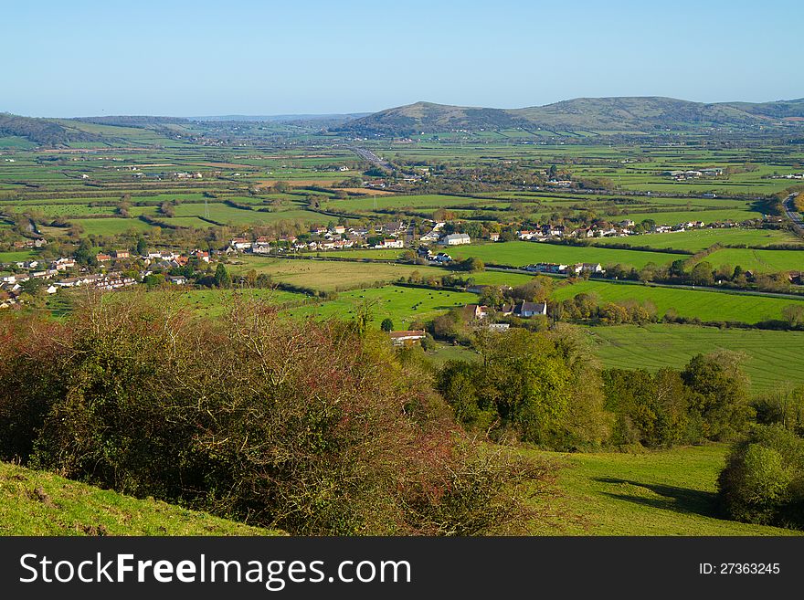 Brent Knoll hill on the Somerset Levels in Somerset, England. It is located half way between Weston-super-Mare and Bridgwater with views of Bristol Channel coast and inland to Crook Peak and Glastonbury Tor. Very popular with walkers and has public footpaths to the top. At the foot of the hill are two villages East Brent and Brent Knoll. The hill dominates the landscape and can be seen for many miles. Brent Knoll hill on the Somerset Levels in Somerset, England. It is located half way between Weston-super-Mare and Bridgwater with views of Bristol Channel coast and inland to Crook Peak and Glastonbury Tor. Very popular with walkers and has public footpaths to the top. At the foot of the hill are two villages East Brent and Brent Knoll. The hill dominates the landscape and can be seen for many miles.