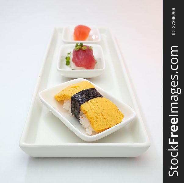 Sushi is Japanese food consisting of cooked vinegared rice combined with other ingredients usually raw fish or other seafood. Sushi is Japanese food consisting of cooked vinegared rice combined with other ingredients usually raw fish or other seafood.