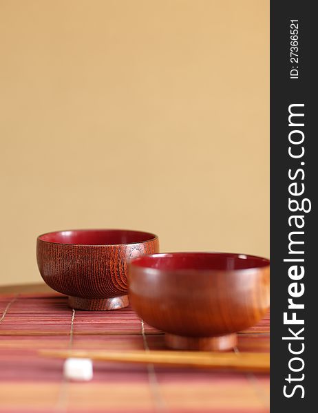 Chopsticks and two soup bowls  in asian set table. Chopsticks and two soup bowls  in asian set table