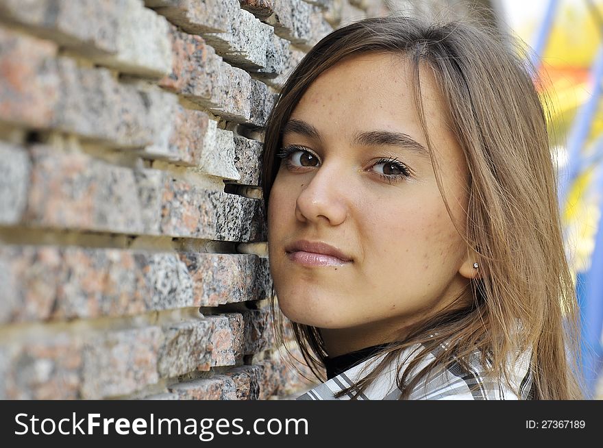 Portrait of girl on a background a wall