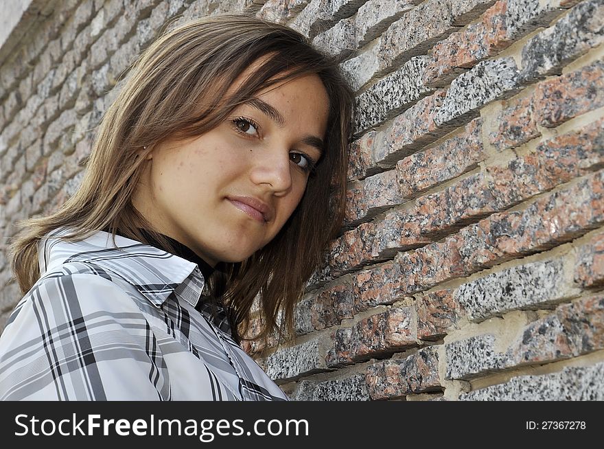 Portrait Of Girl Near A Wall