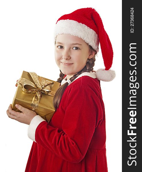 Beautiful girl dressed in Christmas clothes and red santa hat with present in her hands isolated on white background. Beautiful girl dressed in Christmas clothes and red santa hat with present in her hands isolated on white background