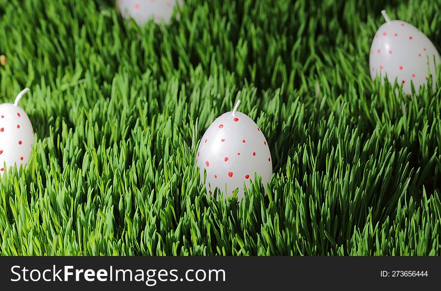 Easter. Eggs On Green Grass. Holiday Day With Family. Religious Holiday. Candles On A Green Background. Candles On A Larva. Colore